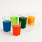 Elegant table setting with transparent plastic tumblers.