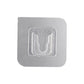 Transparent self-adhesive wall hook ready for easy peel-and-stick application.