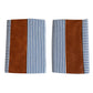 Pair of leather and cotton pillow covers on a modern sofa