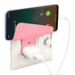 User effortlessly placing a smartphone onto the Gambit wall phone holder for charging.