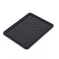Black anti-skid mat securely holding a phone, keys, and sunglasses on a car dashboard.