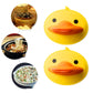 Bright yellow silicone duck-shaped pot holder in practical use