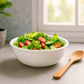 Stackable white plastic serving bowls with deep round shape