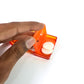Person using the hygienic toilet lid lifter to avoid direct contact with the seat.