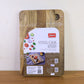 Steel Oak Cutting Board resting on a wooden countertop