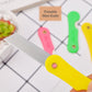 Arrangement of the 12-pack multicolour mini paper cutter knives, highlighting variety.