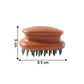 Detailed close-up of flexible bristles on scalp massage brush