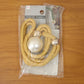 Decorative home curtain tie with braided rope and pearl embellishment