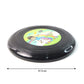 Small outdoor flying disc frisbee toy resting on grass surface