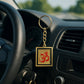 Om Trishul keychain hanging with detailed golden craftsmanship