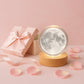 A 3D Crystal Ball Lamp beautifully illuminating a cozy bedroom corner.
