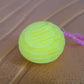 Worm fidget toy in various flexible shapes on white surface