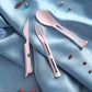 The 3-in-1 reusable spoon, fork, and knife set neatly folded into its compact travel form.