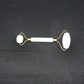 Dual-ended face massage roller displayed on a minimalist white background.