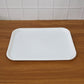 Angled photo of simple functional white plastic serving tray