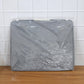 Close-up of the durable double zipper and reinforced handle on the foldable storage bag.