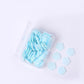 Detailed view of flower-shaped soap sheets beginning to dissolve in water.