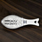 The compact Fish Scale Scraper with a hanging hole for convenient storage.