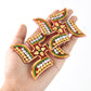 Swastik symbol sticker highlighted with red-orange and gold detailing