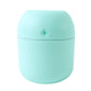 Lifestyle shot of the Mini USB Humidifier placed in a comfortable living space.