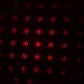 A galaxy projector creating a romantic starry night effect in a dimly lit room.