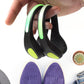 Person jogging at dusk, their shoes lit by bright LED safety clip lights.