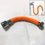 Flexible water tap extender installed on a kitchen faucet, showing its bendable design.