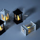 Group of flameless candle lanterns arranged for home decoration.