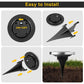 Stainless steel solar powered LED light inserted into grassy outdoor lawn with ground stake