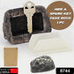 Open fake rock key hider revealing the hidden compartment for a spare key.
