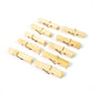 Sturdy wooden clothes pegs made from bamboo arranged for a clear product view.