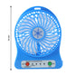 Mini table fan in use at an office desk providing cool airflow