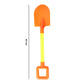 Kids plastic shovel resting on sand outdoors under sunlight