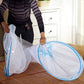 Self-supporting foldable polyester mosquito net tent setup over sleeping area