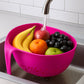 Close-up of ergonomic handle on triangular kitchen colander for comfortable grip