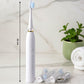 Close-up front view of electric toothbrush with ergonomic handle