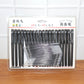 Marker pen set display showing refill sticks alongside the 20 refillable black marker pens