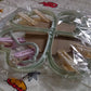 Heart-shaped clothes hanger with 8 clips for efficient drying.