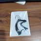Angled view of metal horse face keychain accessory
