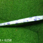 Another view of the elegant dot printed umbrella, highlighting its design.