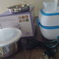 Electric Lunch Box showing the included egg steaming tray and an additional food container.
