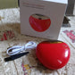 Compact electric nail clipper placed on a clean surface ready for use