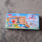 Toddler playing with the wooden mind game, focusing on problem-solving.