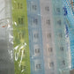 Transparent seven-day pill storage box with four rows for organized tablet keeping.
