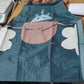 Model wearing cute animal cartoon apron while cooking