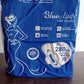 Side view of the sanitary pad, illustrating its thickness and absorbent layers.