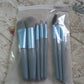 The compact travel case for the mini makeup brush set, perfect for carrying essentials.