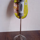 Stainless steel and plastic vegetable masher tool with ergonomic handle