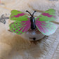 A Butterfly 3D Night Lamp glowing softly on a bedside table.