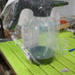 Side view of the 2L electric garden spray bottle in a garden setting.